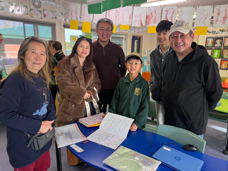 Student Daniel Shu with his family at open classrooms