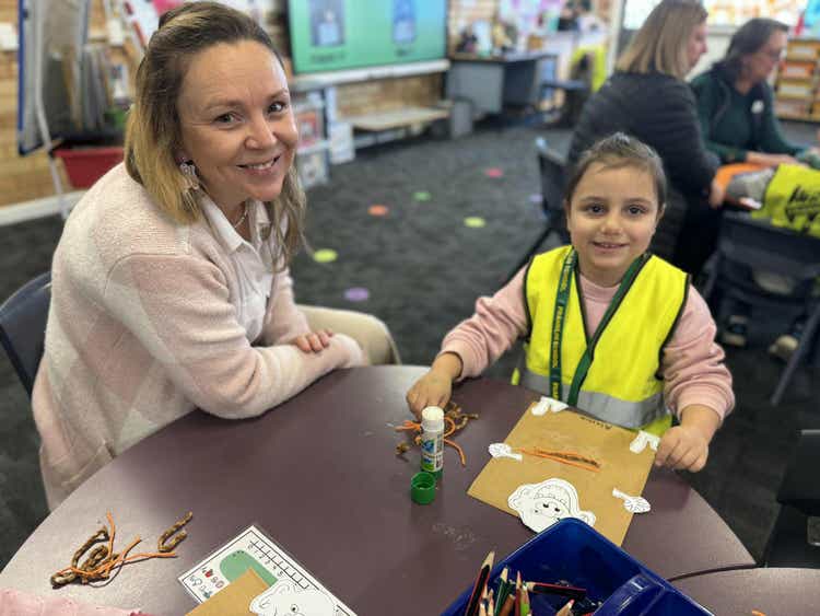 Teacher pictured with student from Early Explorers